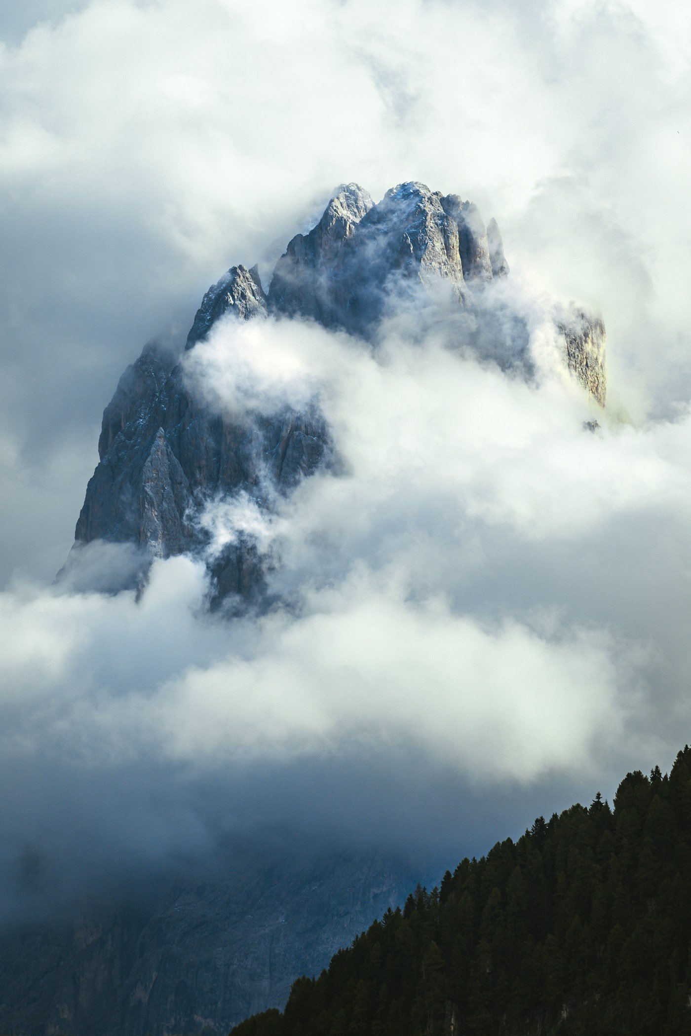 Serene alpine mountain lake surrounded by pine forest in morning mist