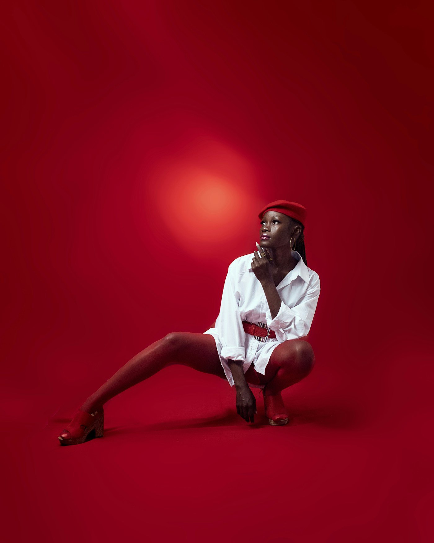 Dramatic high-contrast editorial fashion portrait with soft rim lighting